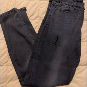 Express Sz 10 black distressed mid-rise denim legging.